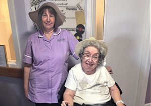 Two Care home residents singing for Parkinsons sufferers