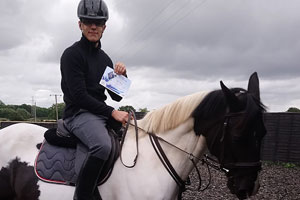 The calming effect of horses - Cameron, who is pictured here riding a black & white horse