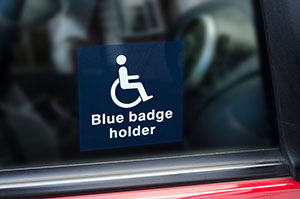 blue badge on side of car
