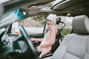 Woman happy in her Motability Scheme car