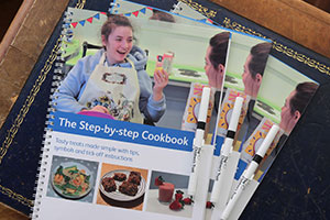 Step-By-Step Cookbook is an accessible cookbook by the Children's Trust