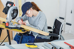 Woman in wheelchair working