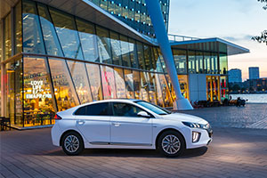 Ioniq electric vehicles in white outside glass building